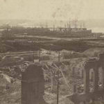 This image shows what remained of a brick building after the Great Seattle Fire of June 6, 1889. The photographer was facing west, and the waterfront is visible in the background. (MOHAI)